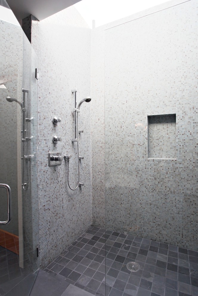 Modern bathroom in San Francisco with a curbless shower, gray tile and mosaic tile.