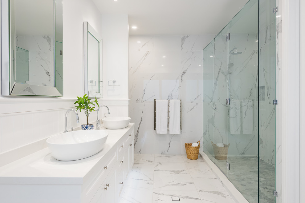 Large beach style master bathroom in Gold Coast - Tweed with white cabinets, marble, white walls, marble floors, a vessel sink, white floor, a hinged shower door, white benchtops, an alcove shower and white tile.