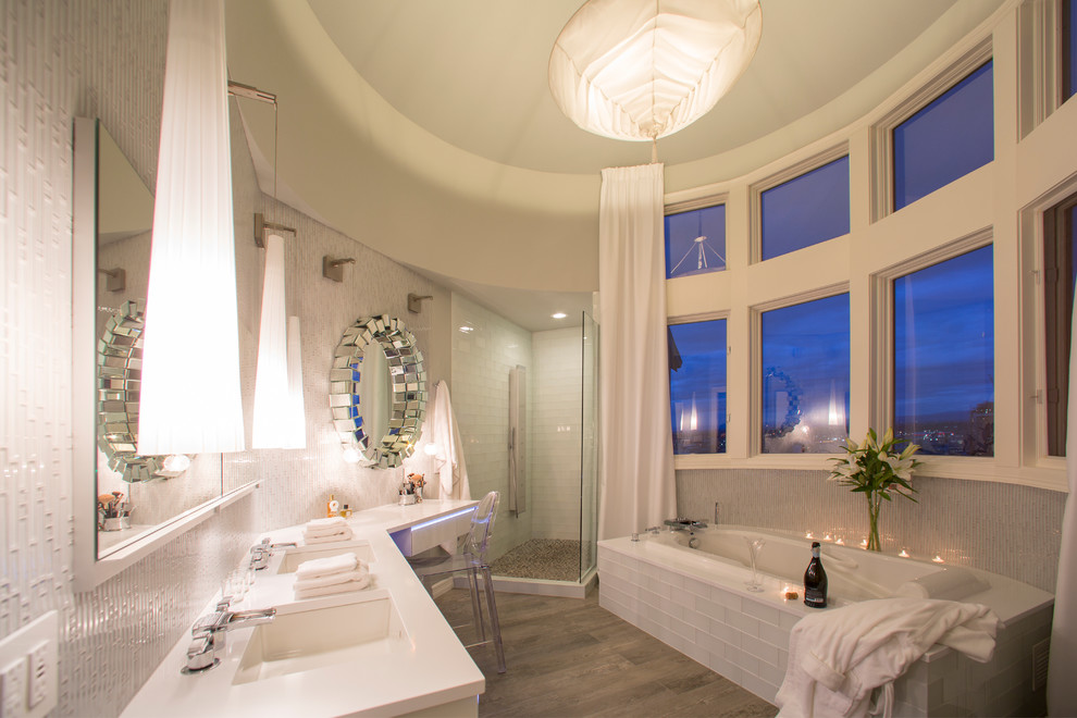 Photo of a mid-sized contemporary master bathroom in Portland with an undermount sink, white cabinets, a double shower, white tile, glass tile, white walls and porcelain floors.