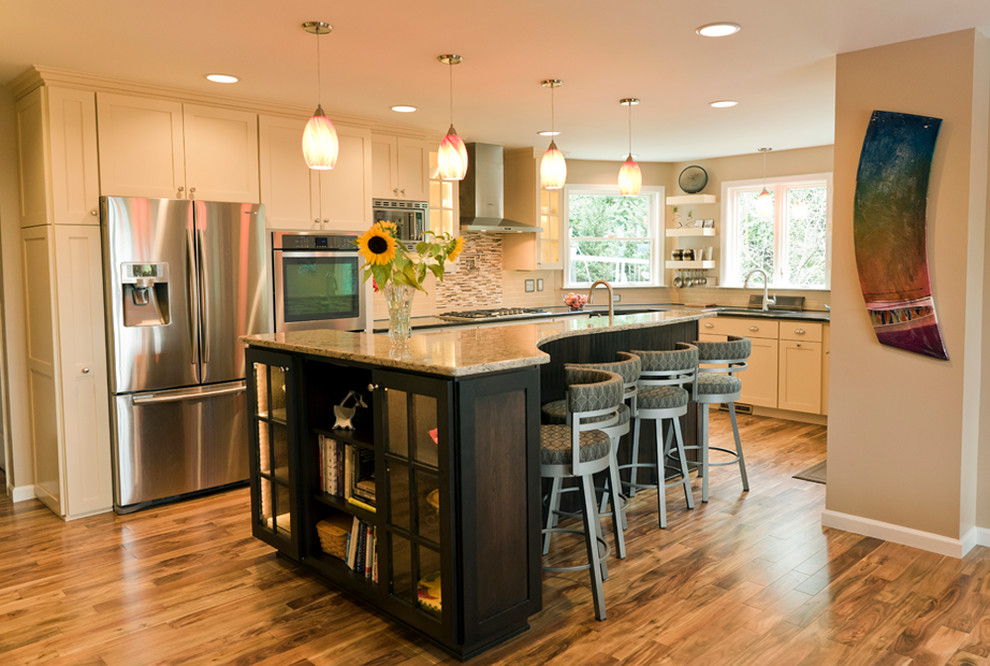Inspiration for an eclectic l-shaped medium tone wood floor open concept kitchen remodel in Baltimore with a double-bowl sink, shaker cabinets, white cabinets, solid surface countertops, gray backsplash, subway tile backsplash, stainless steel appliances and an island