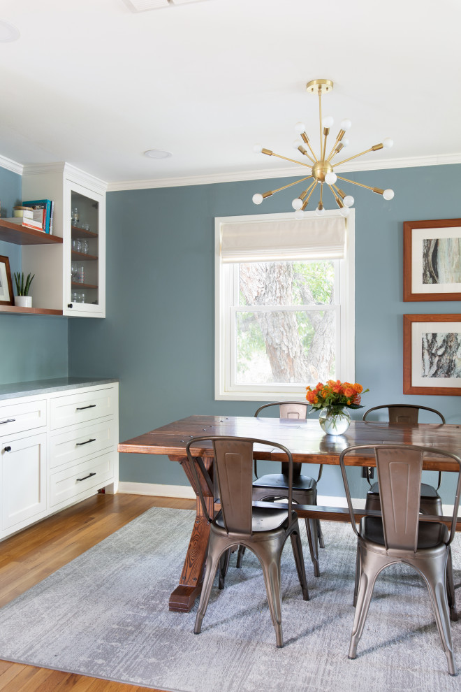 Inspiration for a mid-sized transitional u-shaped light wood floor and brown floor eat-in kitchen remodel in Austin with an undermount sink, shaker cabinets, white cabinets, quartz countertops, blue backsplash, glass tile backsplash, stainless steel appliances, no island and gray countertops