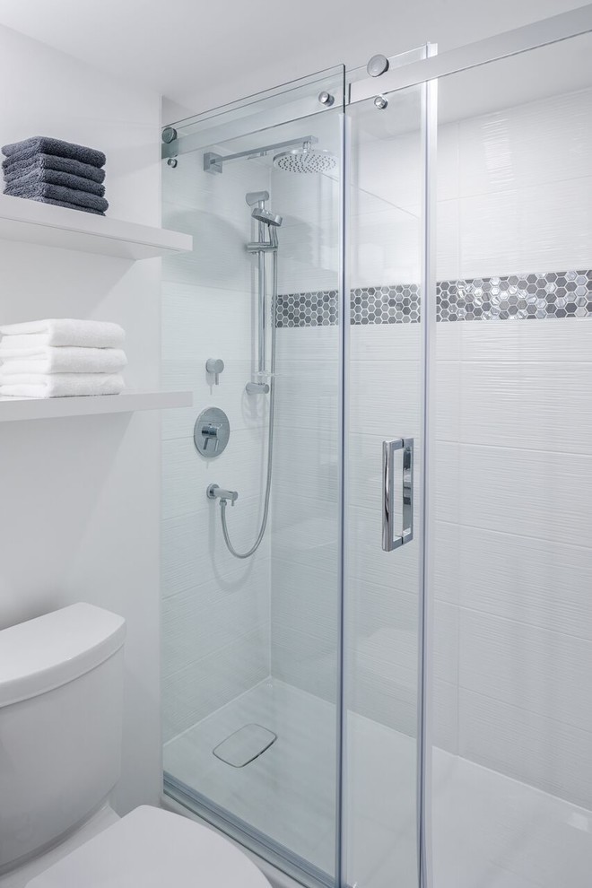 Design ideas for a mid-sized contemporary 3/4 bathroom in Ottawa with flat-panel cabinets, an alcove shower, a drop-in sink, a sliding shower screen, grey cabinets, white tile, ceramic tile, white walls, porcelain floors, engineered quartz benchtops and grey floor.