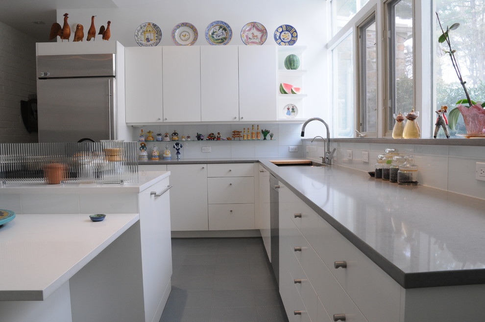 This is an example of a contemporary kitchen in Philadelphia with quartz benchtops.