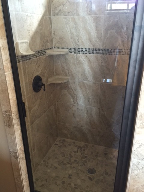 Large mountain style master beige tile and stone tile concrete floor alcove bathtub photo in Austin with flat-panel cabinets, dark wood cabinets, a one-piece toilet, beige walls, an undermount sink and granite countertops