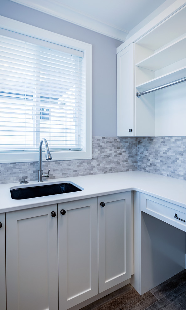 Design ideas for a small traditional l-shaped dedicated laundry room in Vancouver with shaker cabinets, white cabinets and quartzite benchtops.
