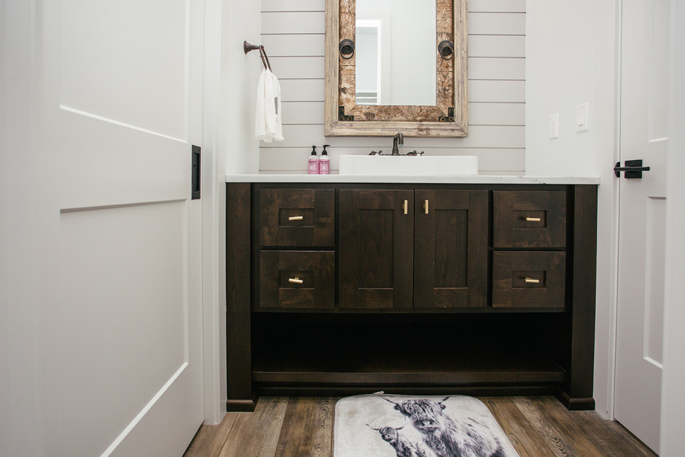 Inspiration for a small country kids bathroom in Portland with shaker cabinets, brown cabinets, engineered quartz benchtops, brown benchtops, a single vanity, a built-in vanity, white walls, medium hardwood floors, an integrated sink and brown floor.