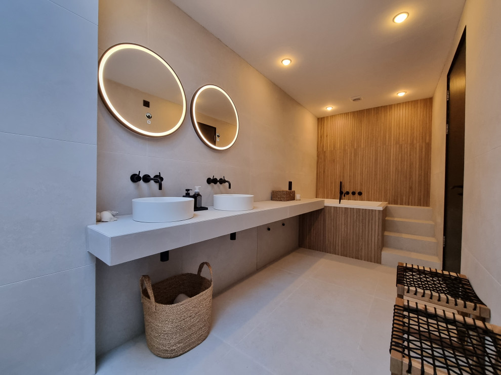 Photo of a large scandinavian bathroom in Other with white cabinets, a japanese bath, a walk-in shower, white tiles, porcelain tiles, porcelain flooring, a vessel sink, tiled worktops, white floors, white worktops, a shower bench, double sinks and a floating vanity unit.