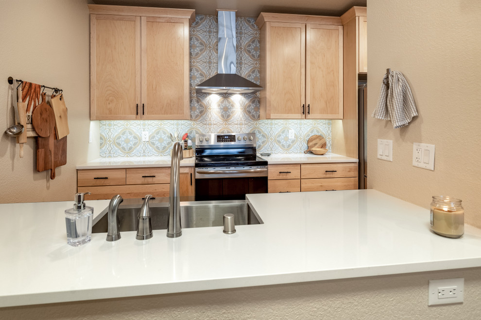 Small transitional galley eat-in kitchen photo with shaker cabinets, light wood cabinets, quartz countertops, cement tile backsplash, stainless steel appliances, no island and white countertops
