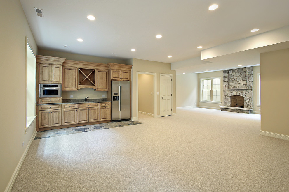 Basement - large rustic look-out carpeted and beige floor basement idea in Calgary with beige walls, a standard fireplace and a stone fireplace