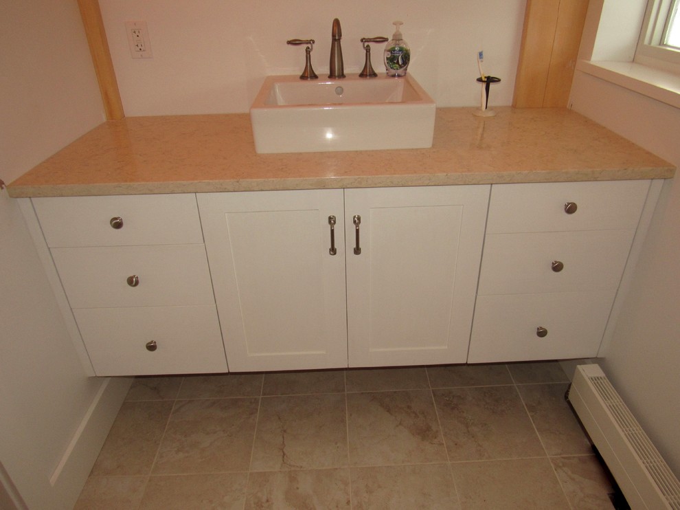 Example of a mid-sized transitional home design design in Burlington