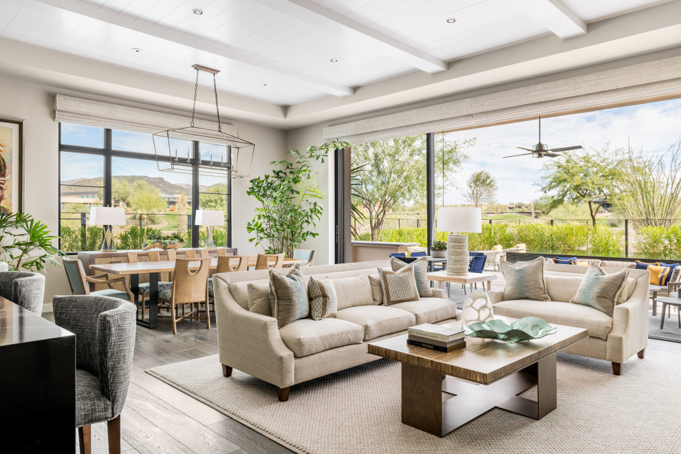 Inspiration for a transitional open concept living room in Phoenix with grey walls, dark hardwood floors, brown floor, exposed beam and timber.