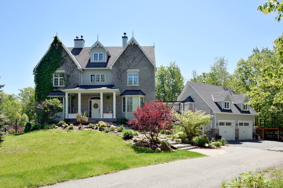Inspiration for a large arts and crafts three-storey grey house exterior in Ottawa with mixed siding.