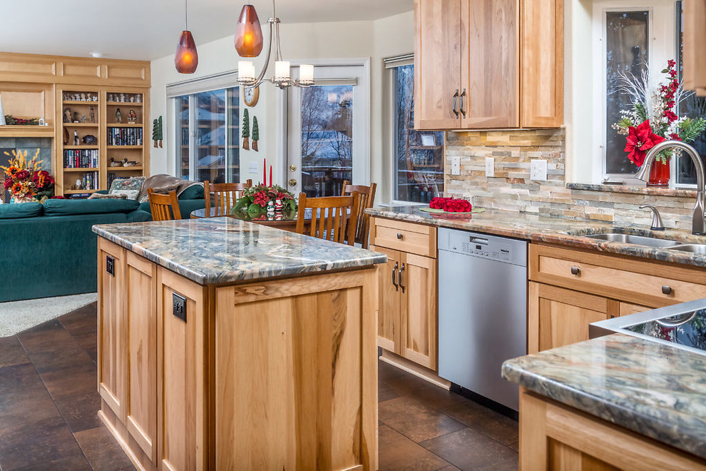 Mid-sized mountain style vinyl floor kitchen photo with an undermount sink, recessed-panel cabinets, light wood cabinets, granite countertops, stainless steel appliances and an island