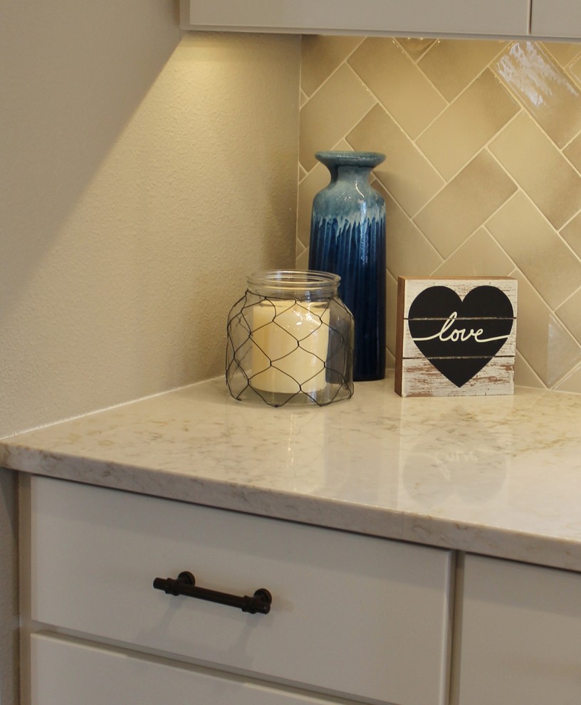 Inspiration for a transitional kitchen remodel with recessed-panel cabinets, white cabinets, quartz countertops and an island