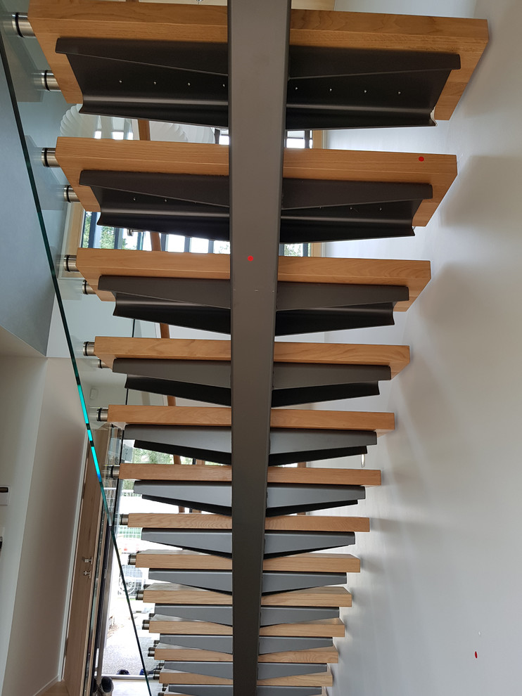 This is an example of a large contemporary staircase in Hamilton.