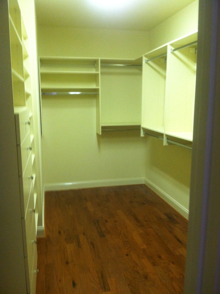 Inspiration for a large contemporary gender-neutral walk-in closet remodel in Birmingham with flat-panel cabinets