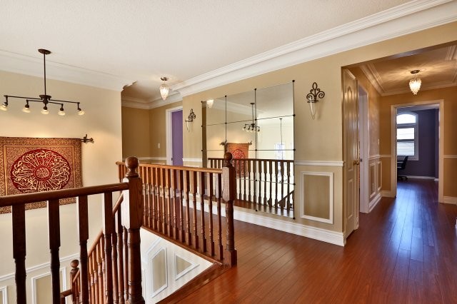 Staircase - large transitional straight staircase idea in Toronto with wooden risers