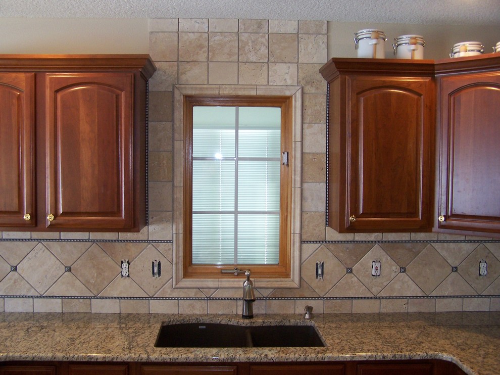Open concept kitchen - traditional galley open concept kitchen idea with granite countertops and stone tile backsplash