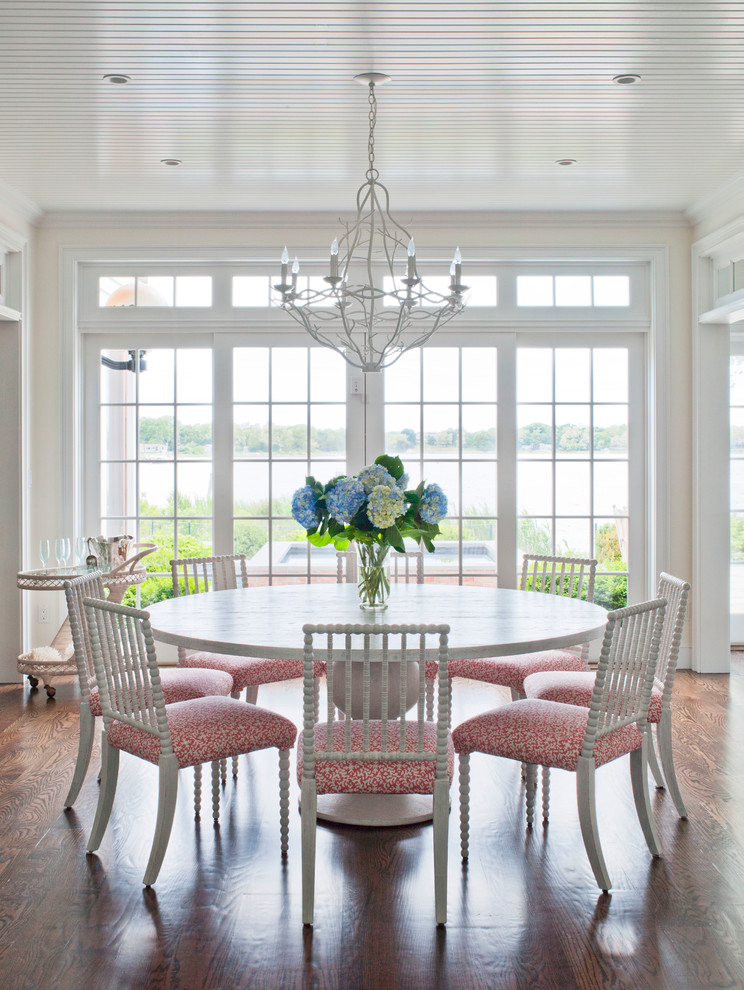 Photo of a beach style dining room in New York with medium hardwood floors and no fireplace.