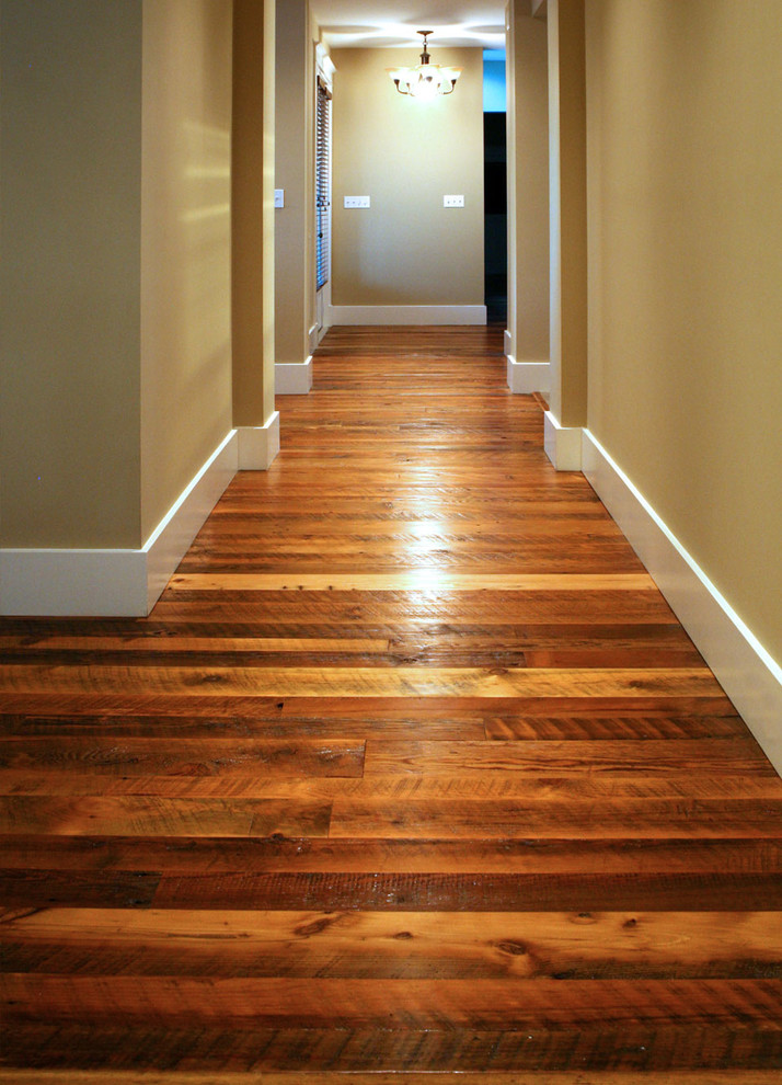 Inspiration for a mid-sized traditional hallway in Cleveland with beige walls and medium hardwood floors.