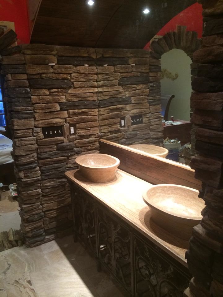 Small mountain style master travertine floor drop-in bathtub photo with a vessel sink and granite countertops