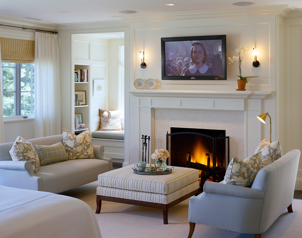 Design ideas for a traditional bedroom in Boston with a standard fireplace and a tile fireplace surround.