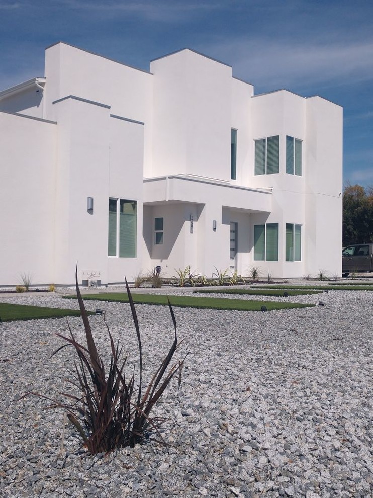 Large minimalist white two-story stucco flat roof photo