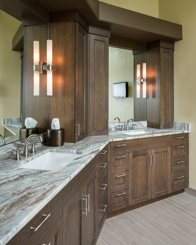 Inspiration for a large transitional master bathroom in Seattle with recessed-panel cabinets, medium wood cabinets, granite benchtops, a freestanding tub, yellow tile, ceramic tile, yellow walls and travertine floors.