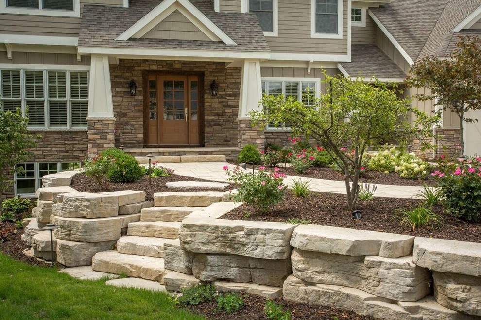 Design ideas for a mid-sized traditional backyard partial sun formal garden for spring in Chicago with a garden path and natural stone pavers.