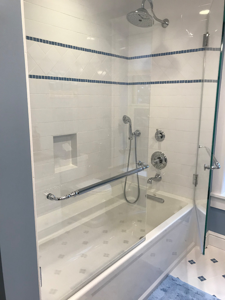 Small traditional master bathroom in Bridgeport with furniture-like cabinets, white cabinets, an alcove tub, a shower/bathtub combo, a one-piece toilet, white tile, grey walls, ceramic floors, an undermount sink, granite benchtops, white floor and a hinged shower door.