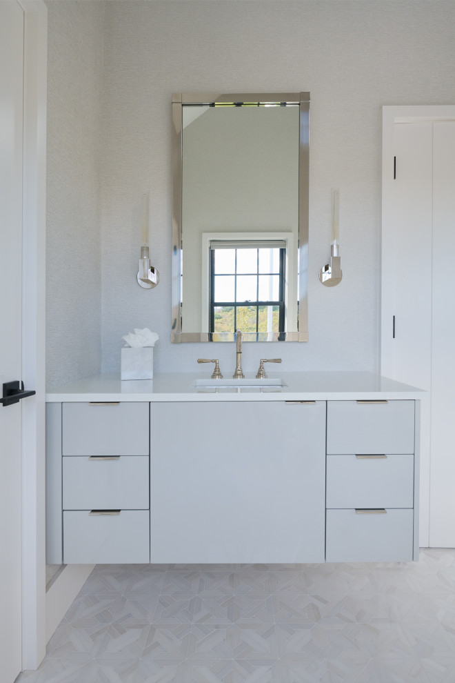 Example of a minimalist porcelain tile, gray floor and double-sink bathroom design in New York with flat-panel cabinets, white cabinets, gray walls, an undermount sink, recycled glass countertops, a hinged shower door, white countertops and a floating vanity