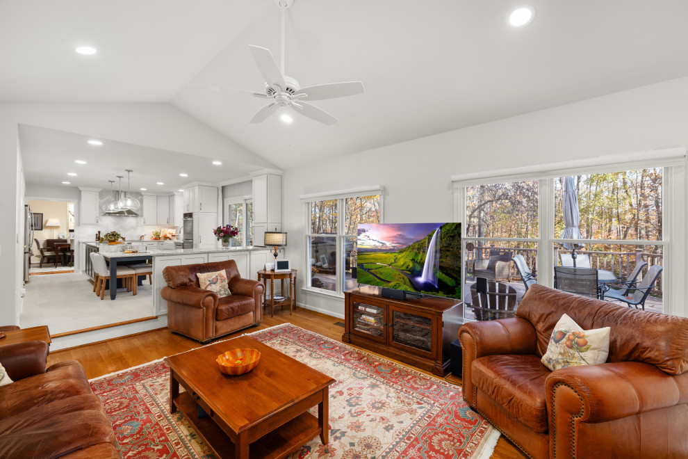 Inspiration for a mid-sized transitional kitchen remodel in DC Metro with shaker cabinets, white cabinets, quartz countertops, porcelain backsplash, stainless steel appliances and an island