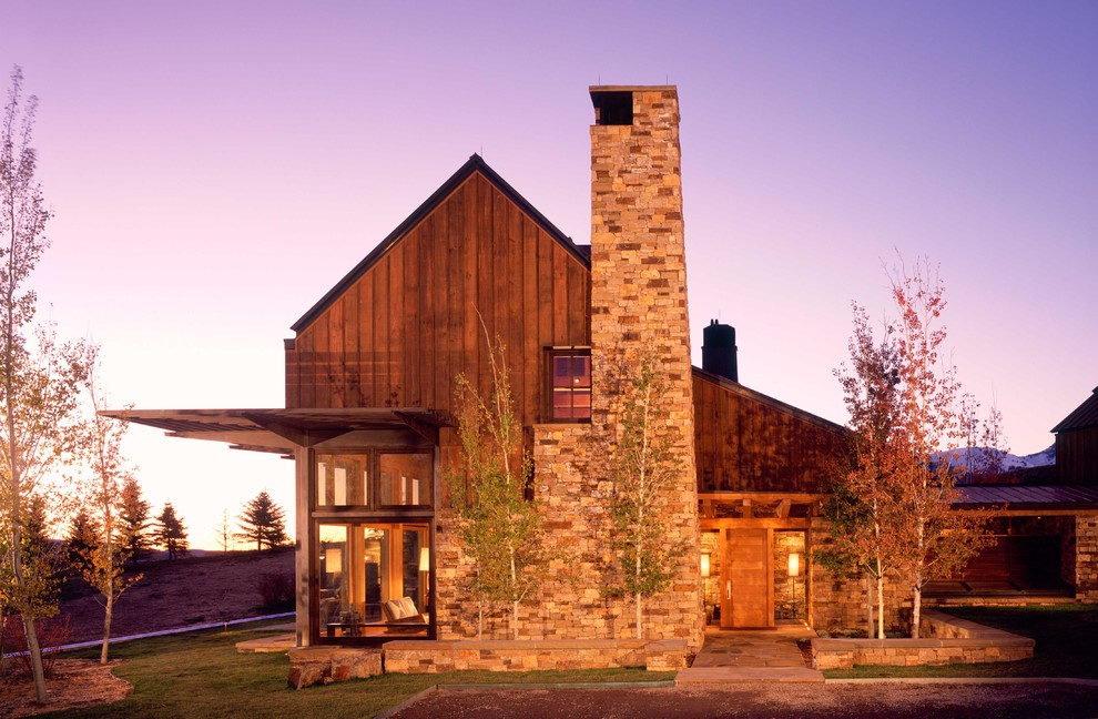 Design ideas for a country exterior in Denver with stone veneer.