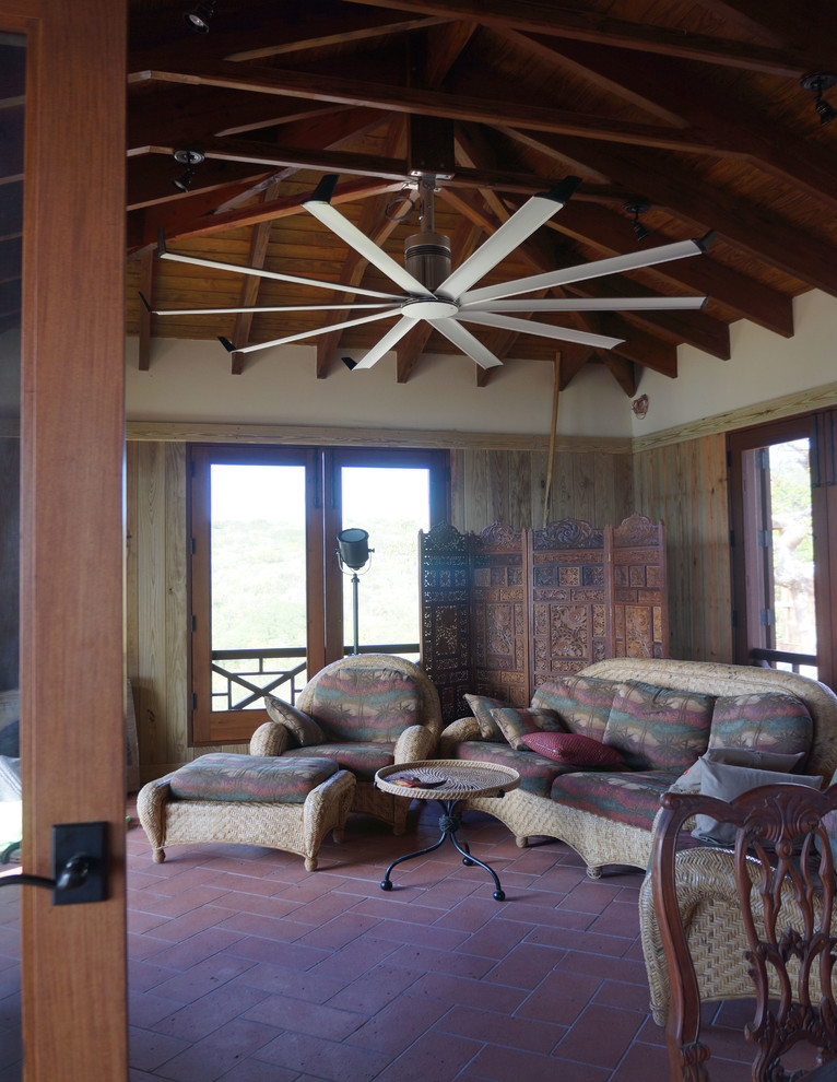 This is an example of a tropical living room in Other.