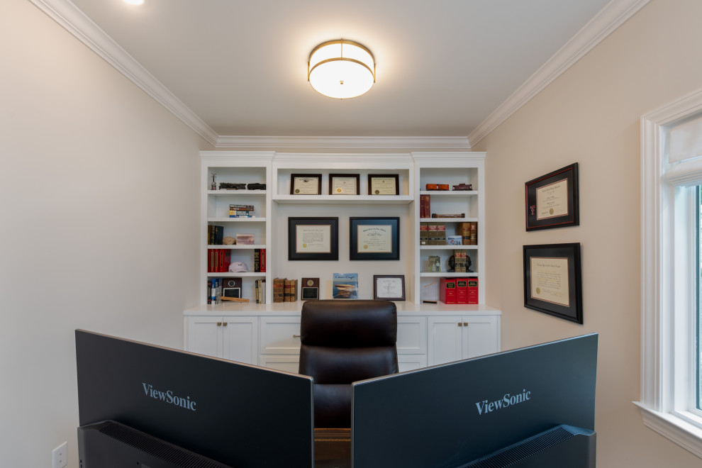 Medium sized traditional study in Other with grey walls, laminate floors, a freestanding desk and grey floors.
