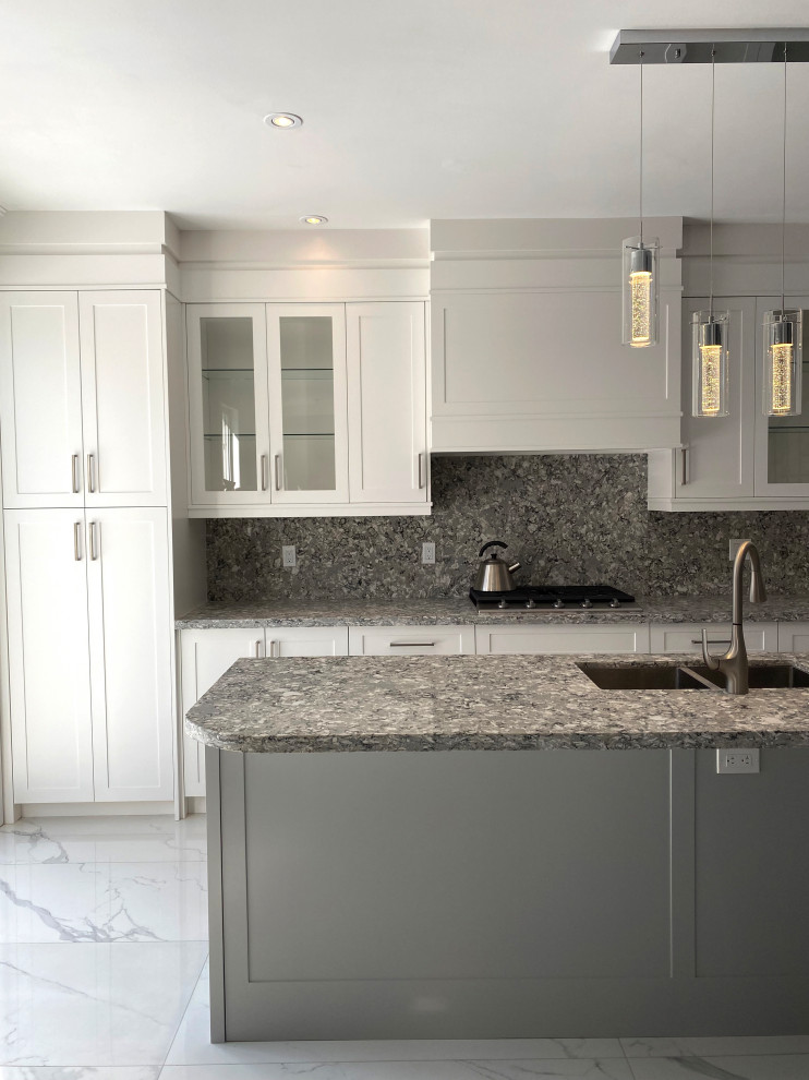 Example of a large transitional l-shaped eat-in kitchen design in Toronto with flat-panel cabinets, white cabinets and an island