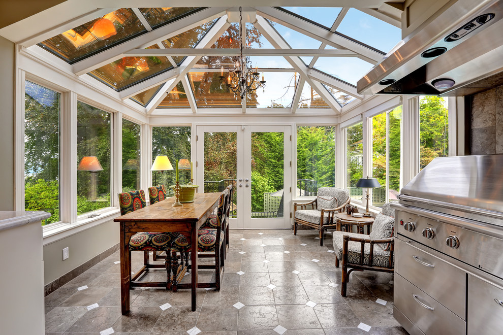 Design ideas for a traditional sunroom in Los Angeles with a glass ceiling and grey floor.