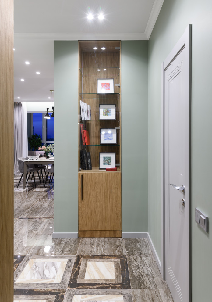 Photo of a mid-sized contemporary entryway in Novosibirsk with grey walls, porcelain floors, a single front door, a gray front door and brown floor.