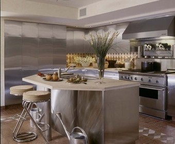 This is an example of an expansive modern u-shaped eat-in kitchen in New York with a single-bowl sink, flat-panel cabinets, stainless steel cabinets, limestone benchtops, multi-coloured splashback, marble splashback, stainless steel appliances, marble floors, with island and multi-coloured floor.