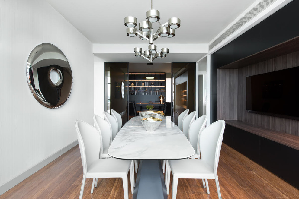 Inspiration for a large contemporary dining room in Melbourne with white walls and bamboo floors.