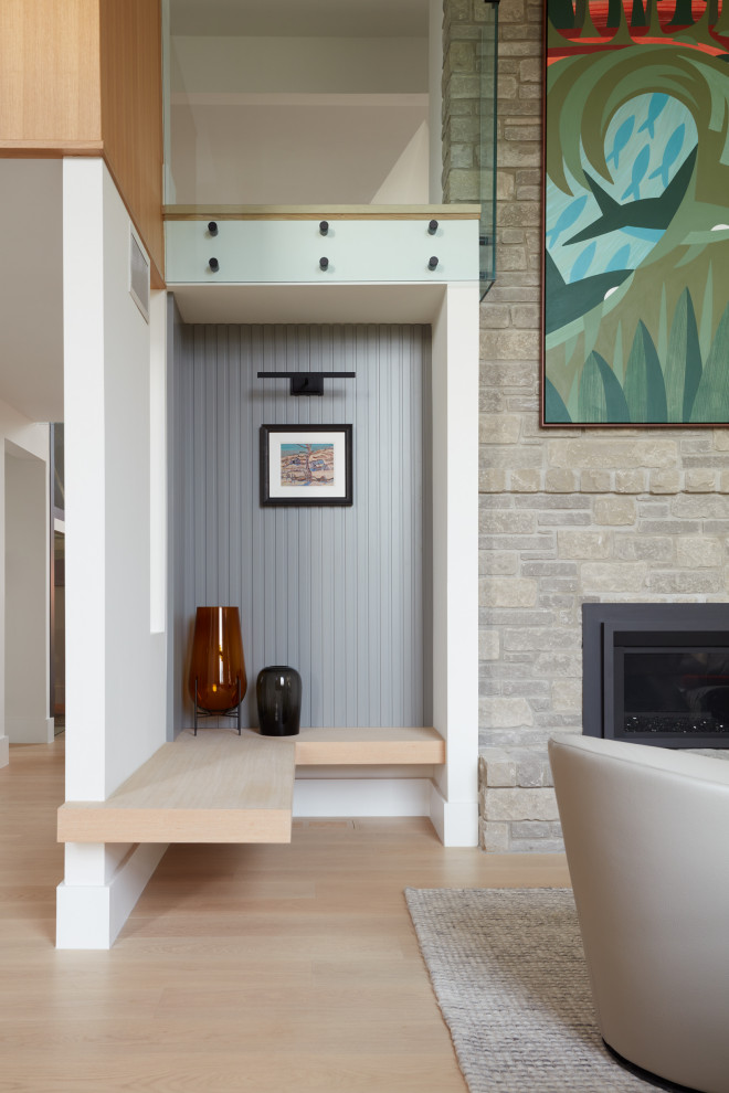 Design ideas for a small modern entryway in Toronto with white walls and panelled walls.