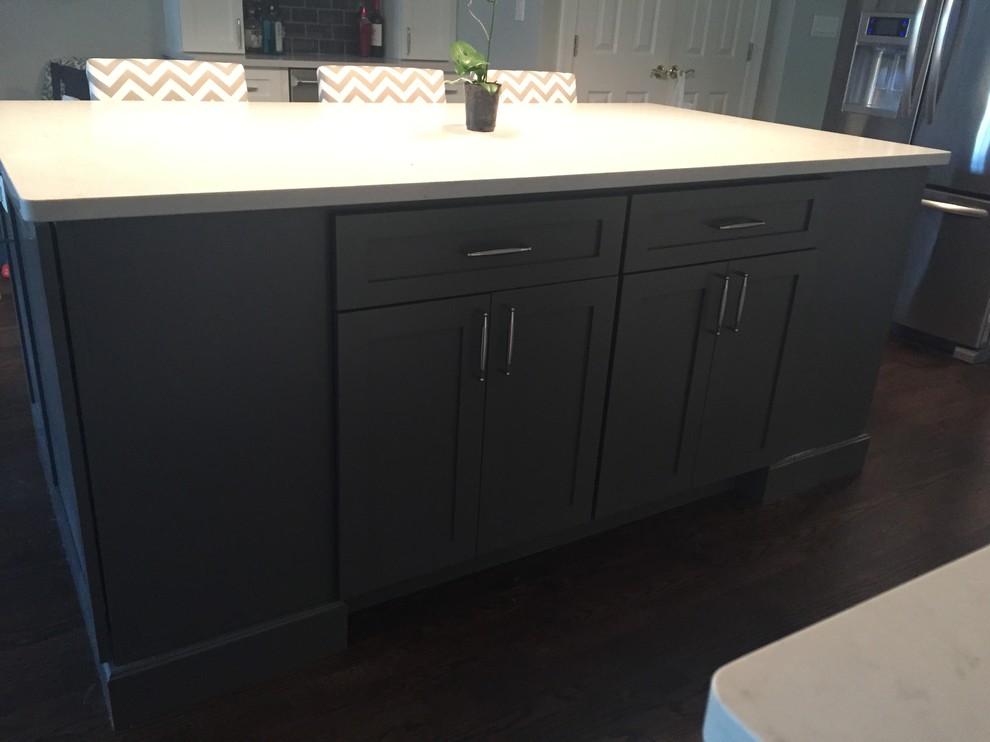 Inspiration for a transitional l-shaped dark wood floor kitchen remodel in Chicago with an undermount sink, shaker cabinets, dark wood cabinets, quartz countertops and an island