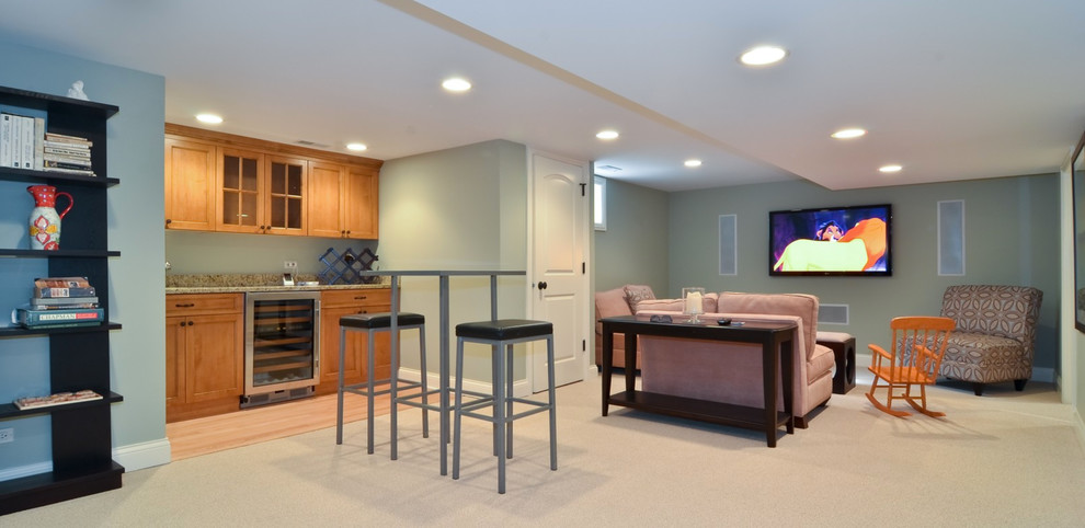 This is an example of a mid-sized transitional look-out basement in Chicago with blue walls and carpet.