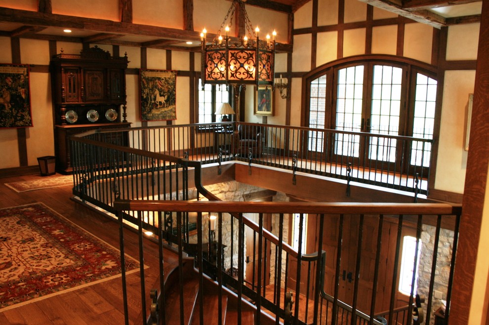 Design ideas for a large traditional hallway in Milwaukee with beige walls and dark hardwood floors.