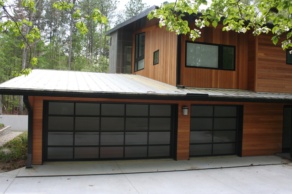 Mid-sized modern attached three-car carport in Raleigh.