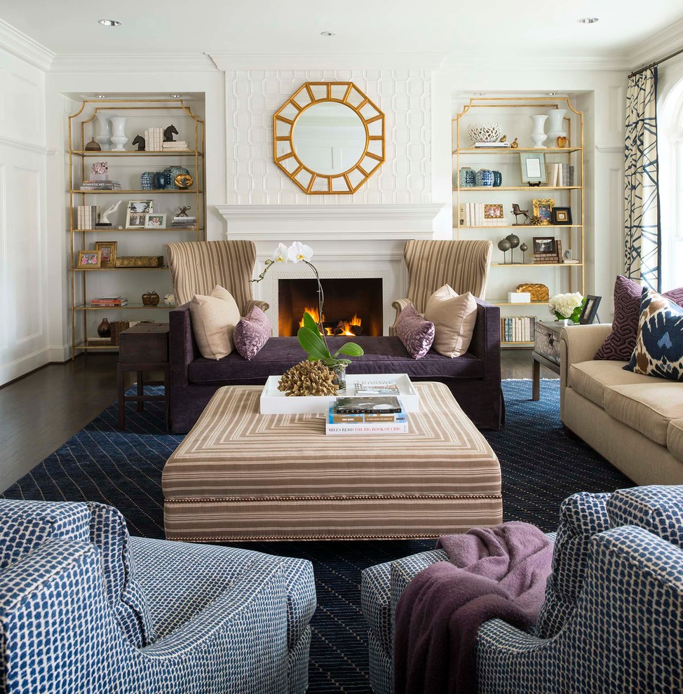 This is an example of a traditional formal living room in Dallas with white walls, dark hardwood floors and a standard fireplace.