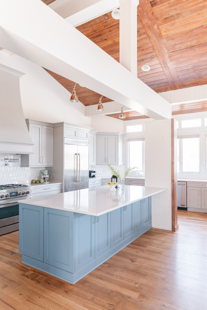 Inspiration for a large transitional kitchen remodel in Omaha with an island