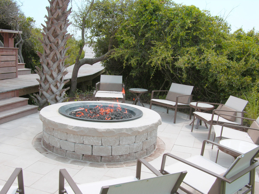 This is an example of a mid-sized contemporary backyard full sun garden in Charleston with a fire feature and concrete pavers.
