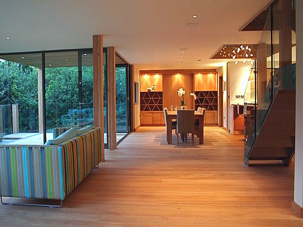 This is an example of a contemporary dining room in West Midlands with blue walls.