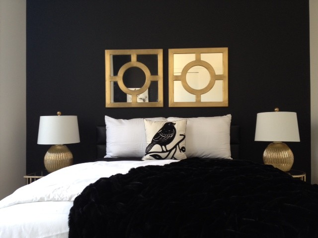 This is an example of a small contemporary guest bedroom in Philadelphia with black walls and carpet.
